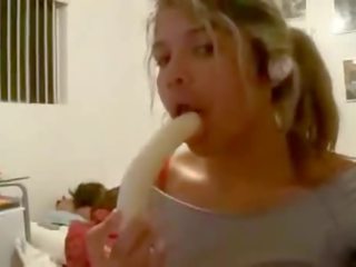 Beautiful Teen Deepthroats A Banana In Her Room